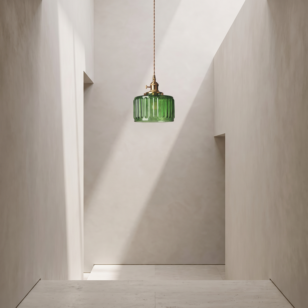 Green glass pendant in a minimal hallway