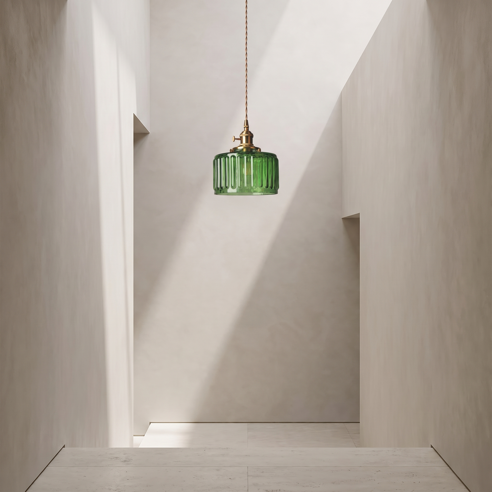 Green glass pendant in a minimal hallway