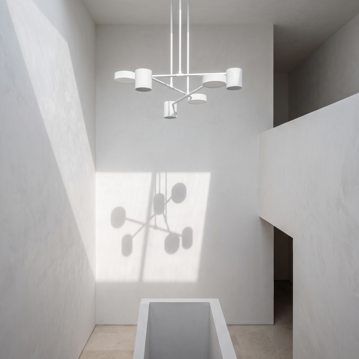Geometric pendant in a double height stairwell