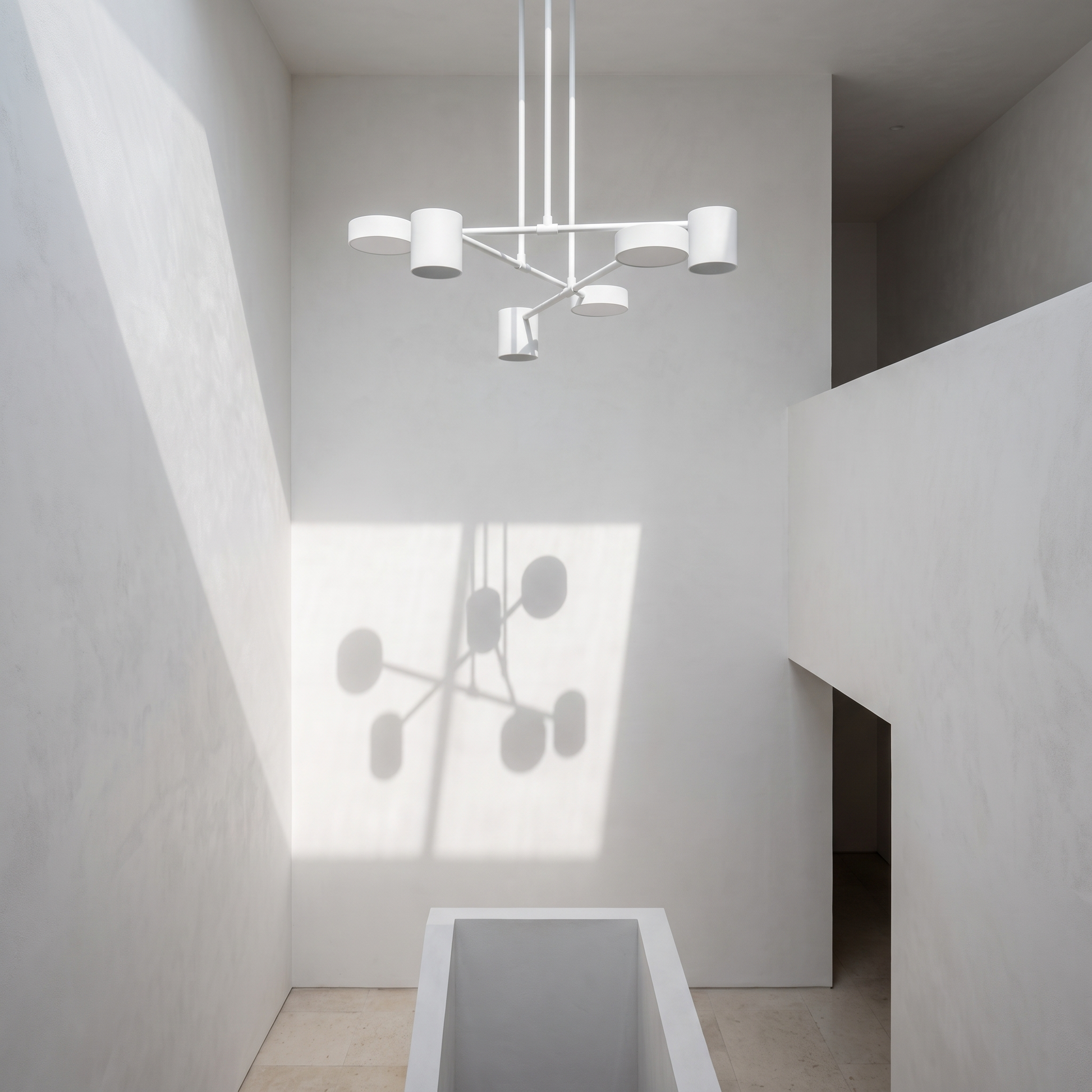Geometric pendant in a double height stairwell