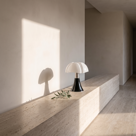 Flower table lamp on a travertine ledge in a hallway