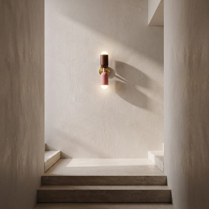Dual bulb wall lamp on a tall stairwell wall