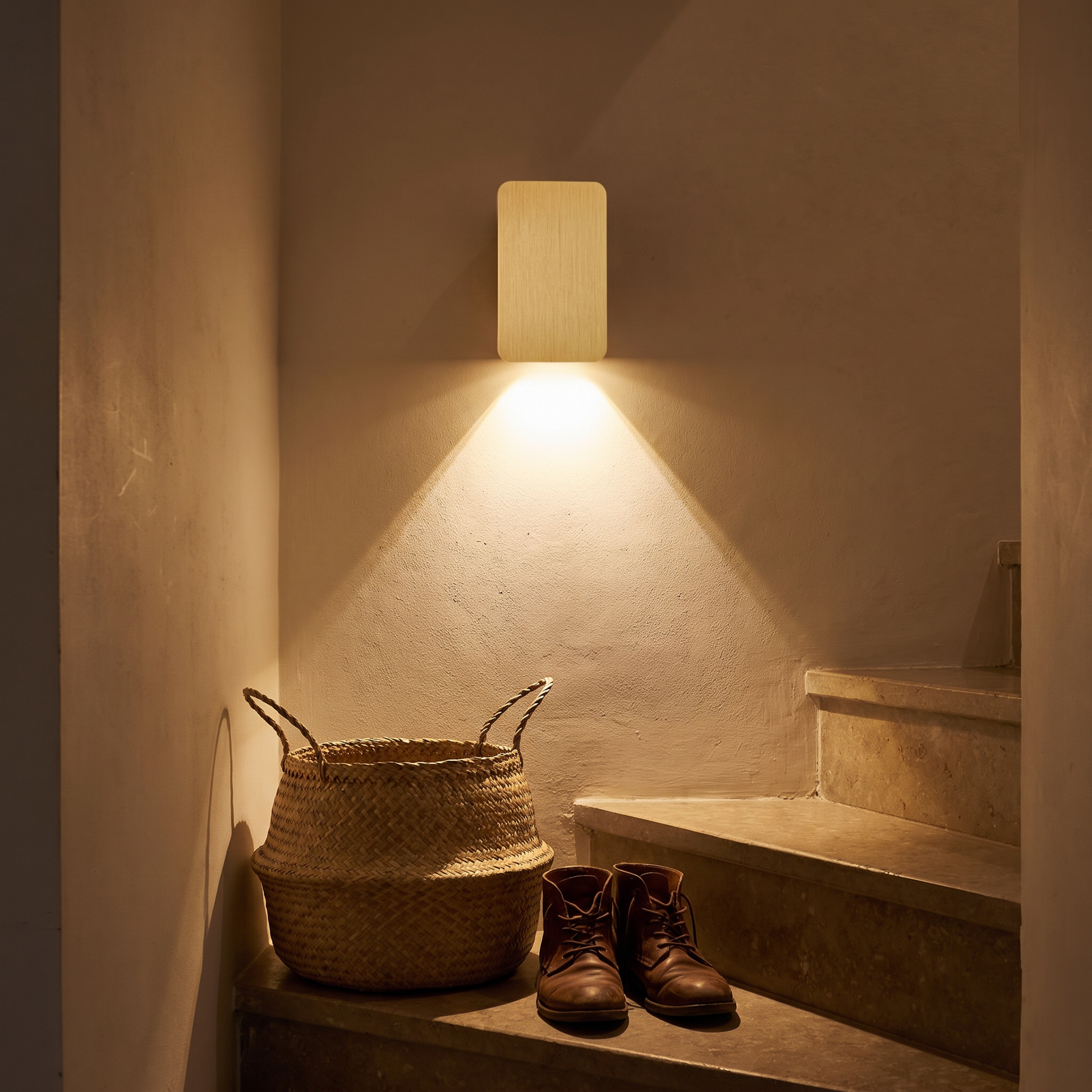 Square wall lamp lit in a stairwell at night