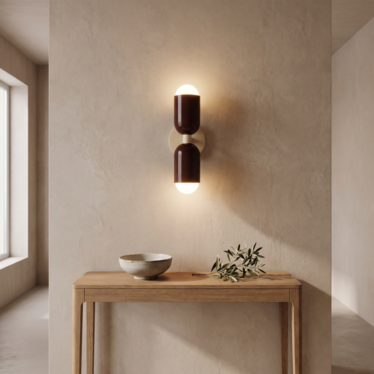 Dual bulb wall lamp above a hallway console