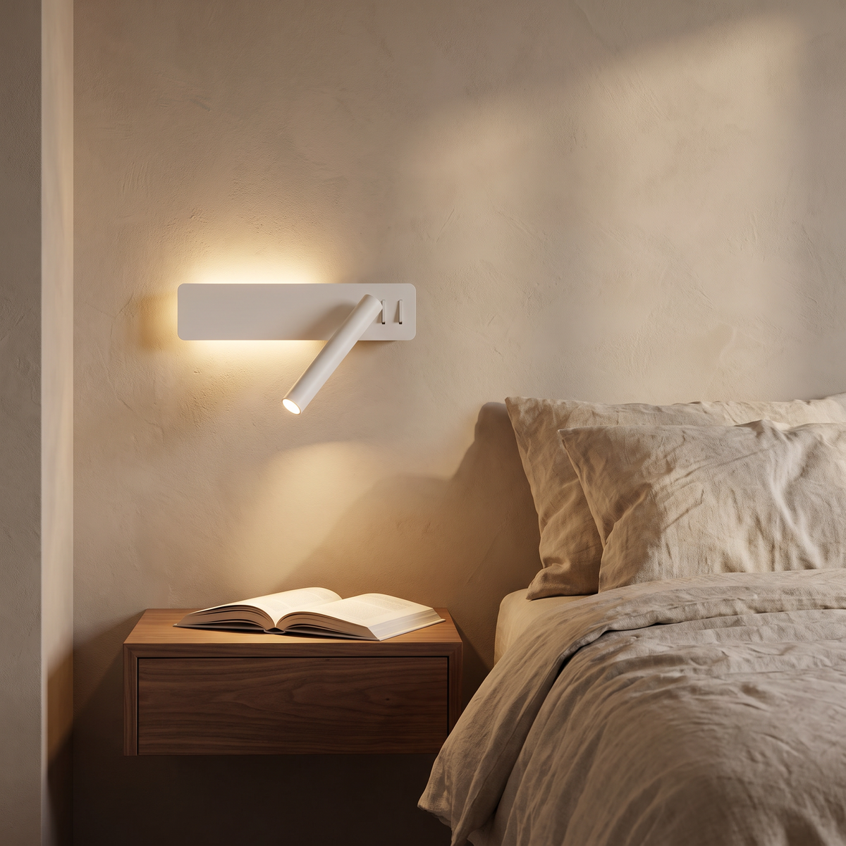 Reading arm wall light beside a bed