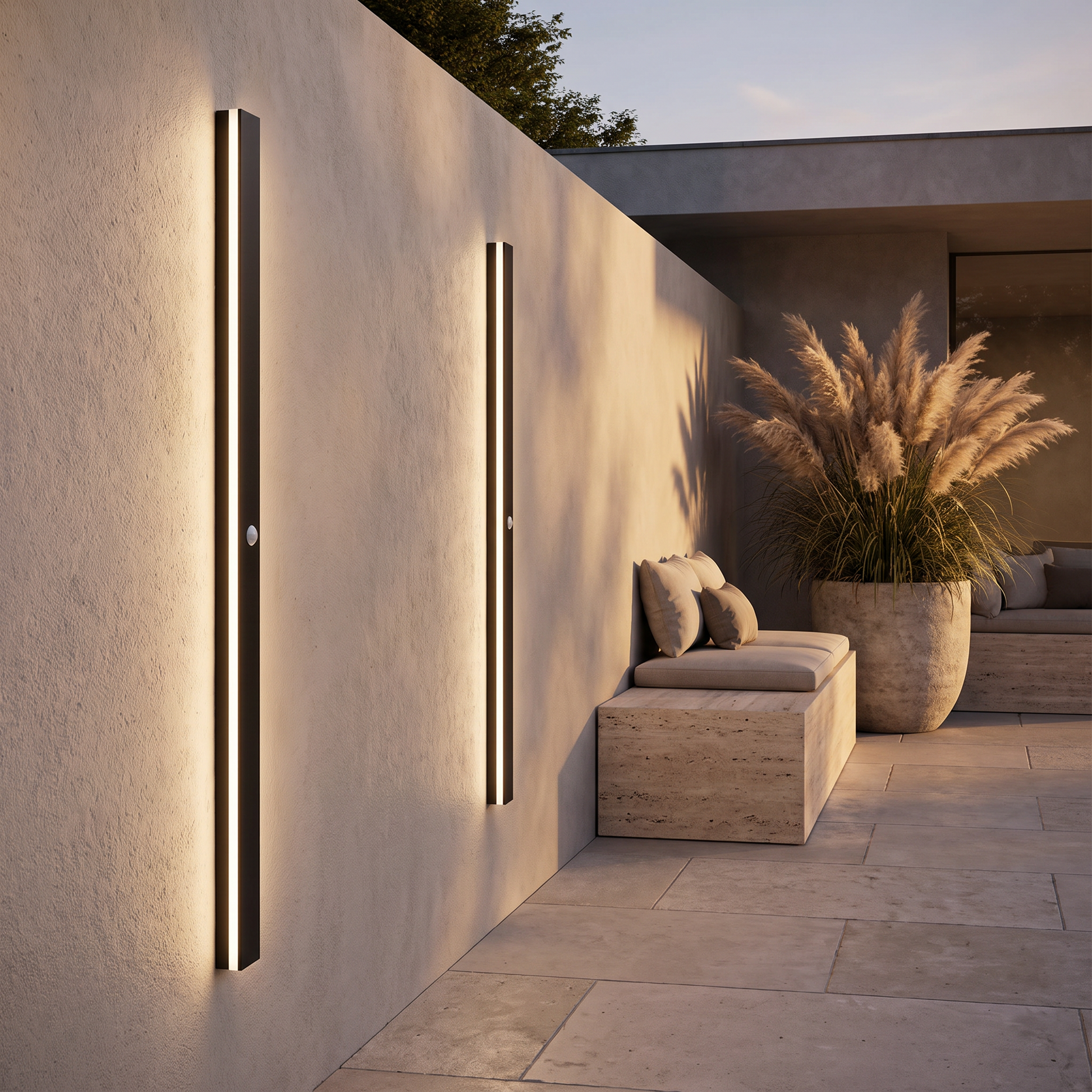 Outdoor wall lamps along a garden terrace wall