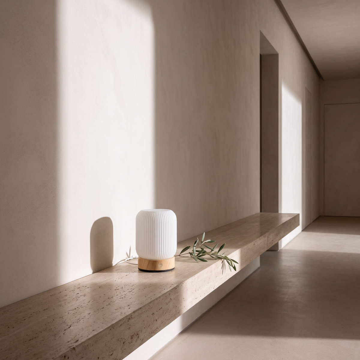 Touch lamp on a travertine ledge in a hallway