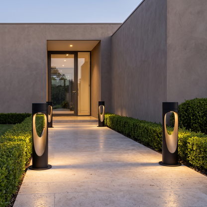 Outdoor floor lamps flanking an entrance path