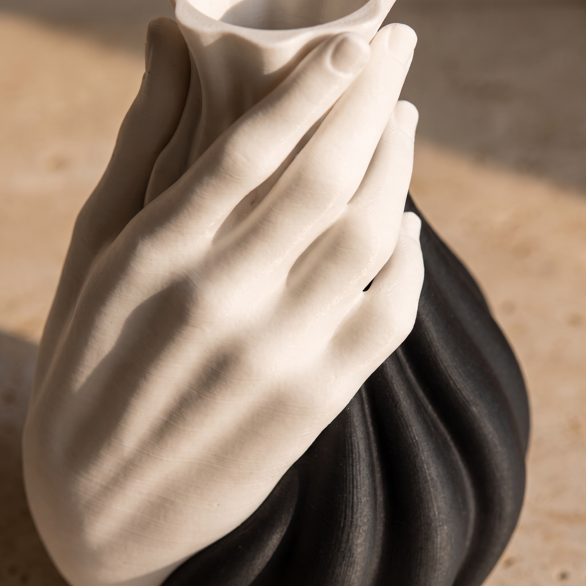 Close detail of the sculpted hand motif and glaze