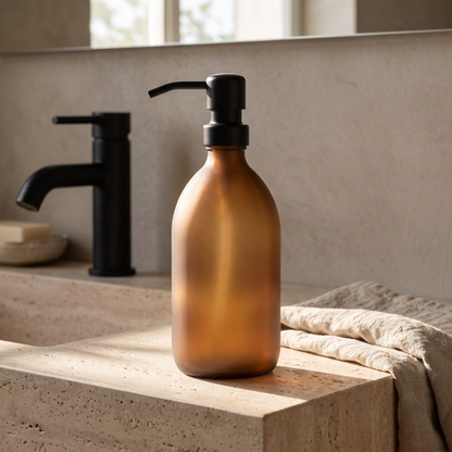 Amber glass dispenser on a bathroom vanity
